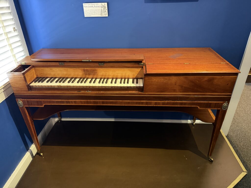 A small piano made out of wood